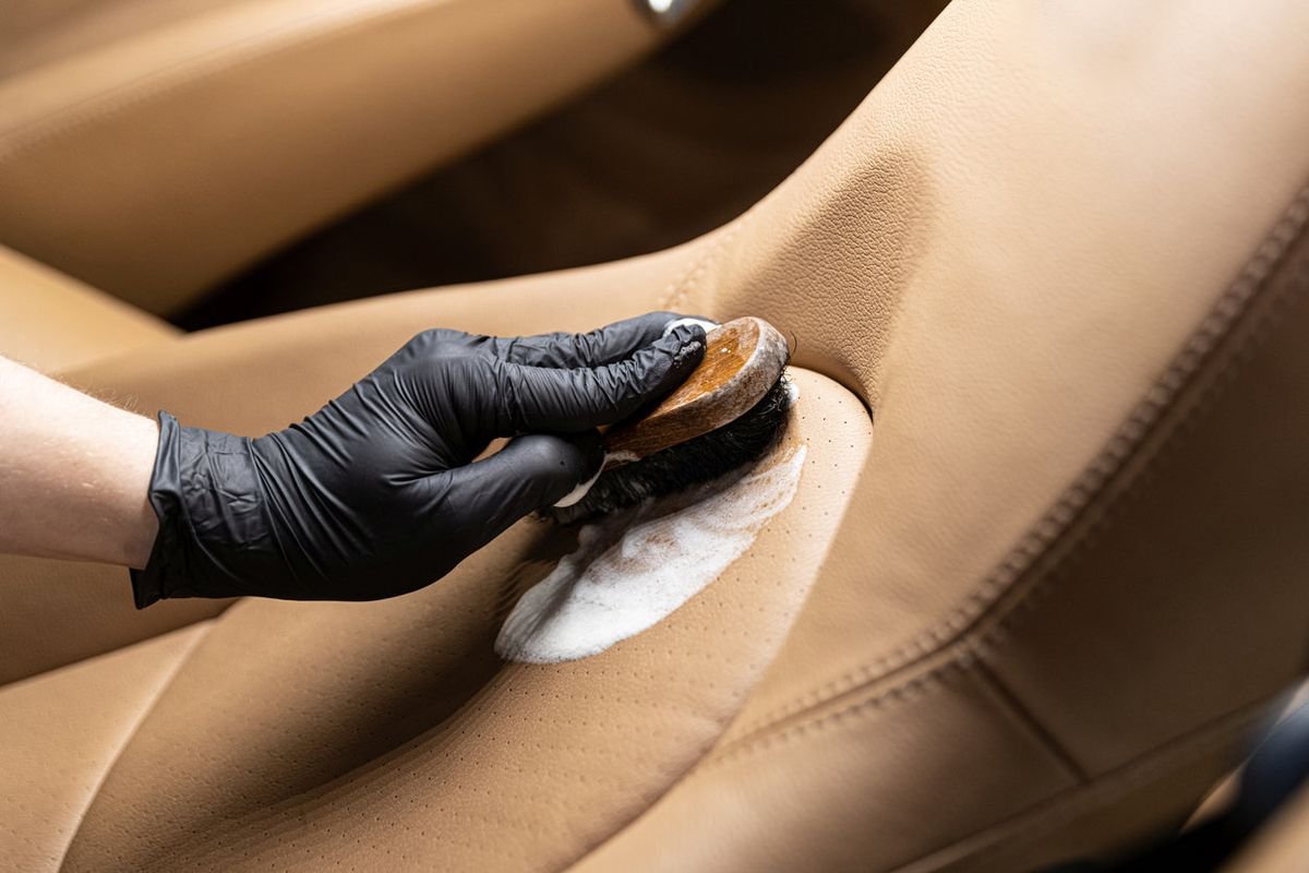 Leather deep cleaning during interior car detailing service