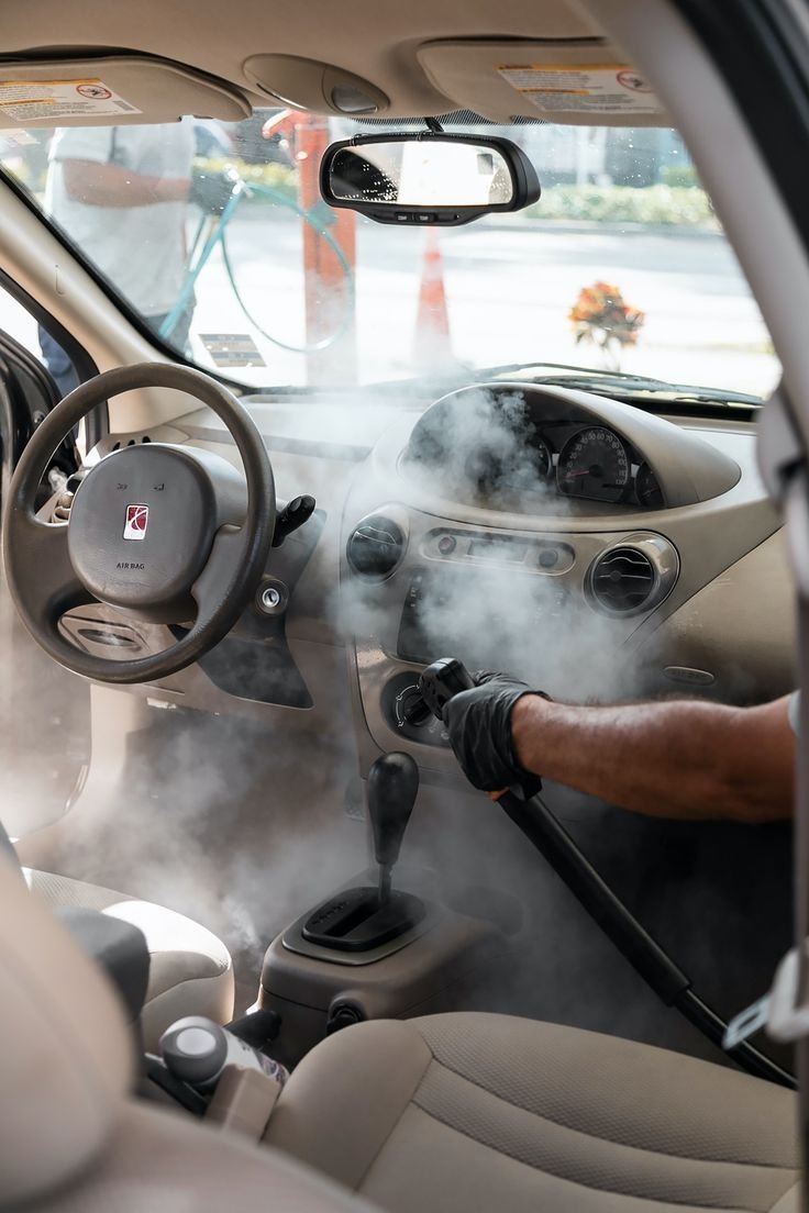 Steam cleaning during interior car detailing service in Pittsford NY